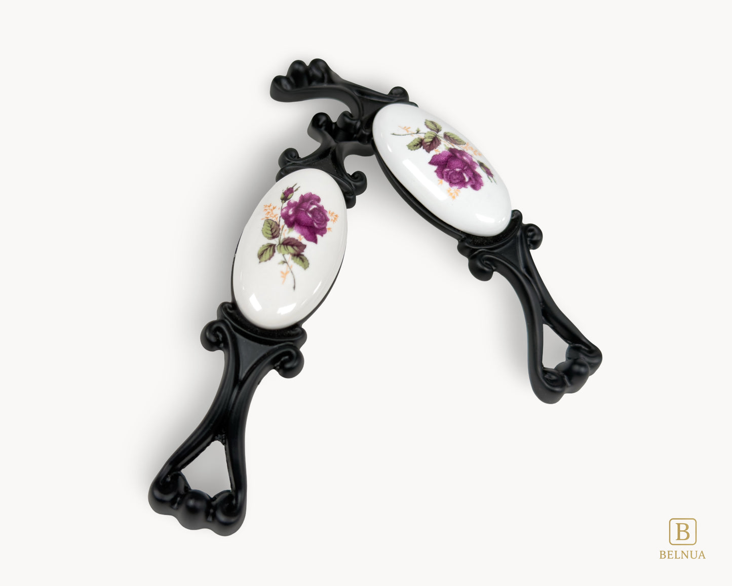 Belnua - Top angled of Nureya cabinet pull handle with black metal base featuring rose motif on white ceramic/porcelain