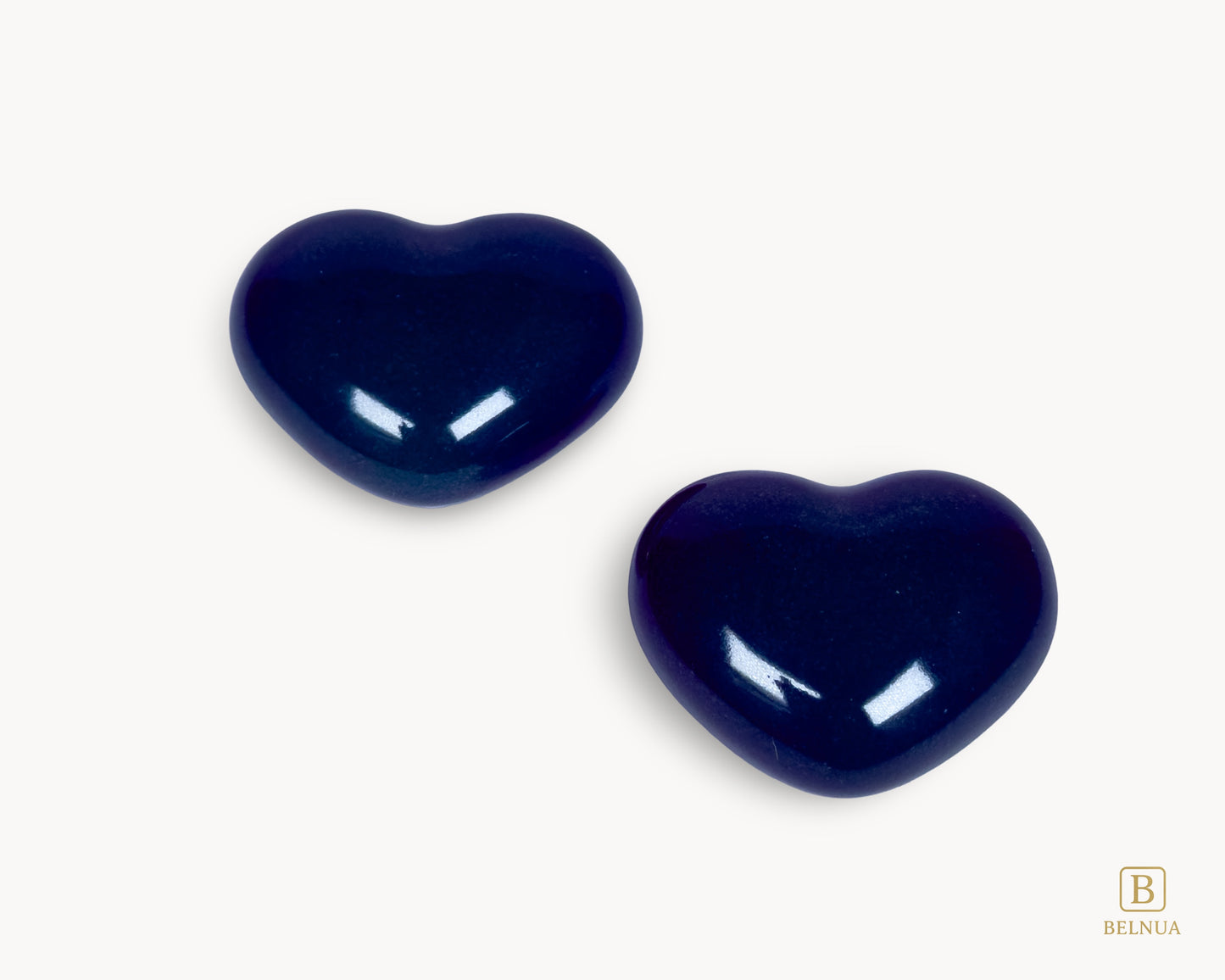 Pair of Belnua Veyla cobalt porcelain heart knobs arranged in flat lay