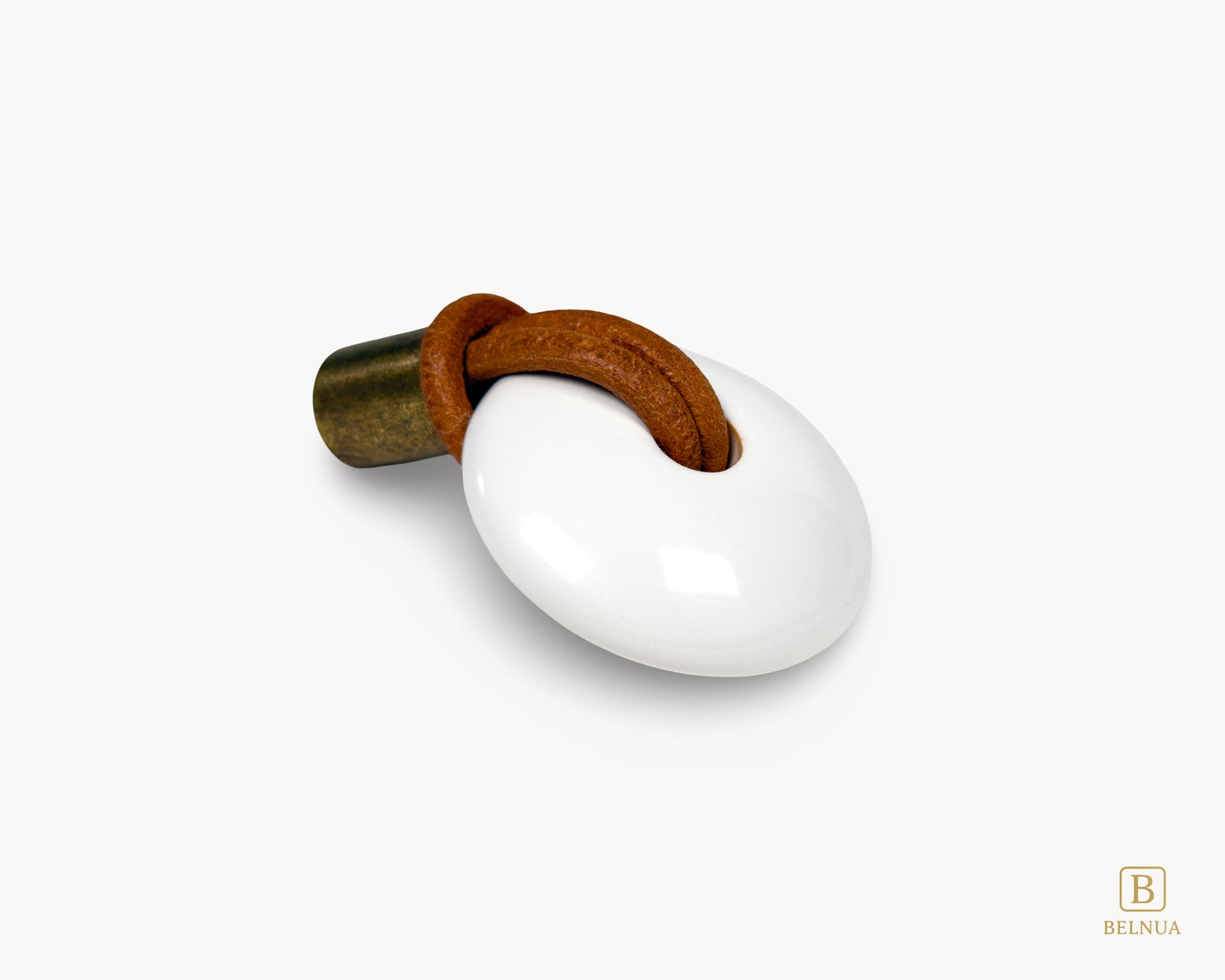 Detailed close-up showing the texture of the antique brass hardware and smooth white porcelain finish.