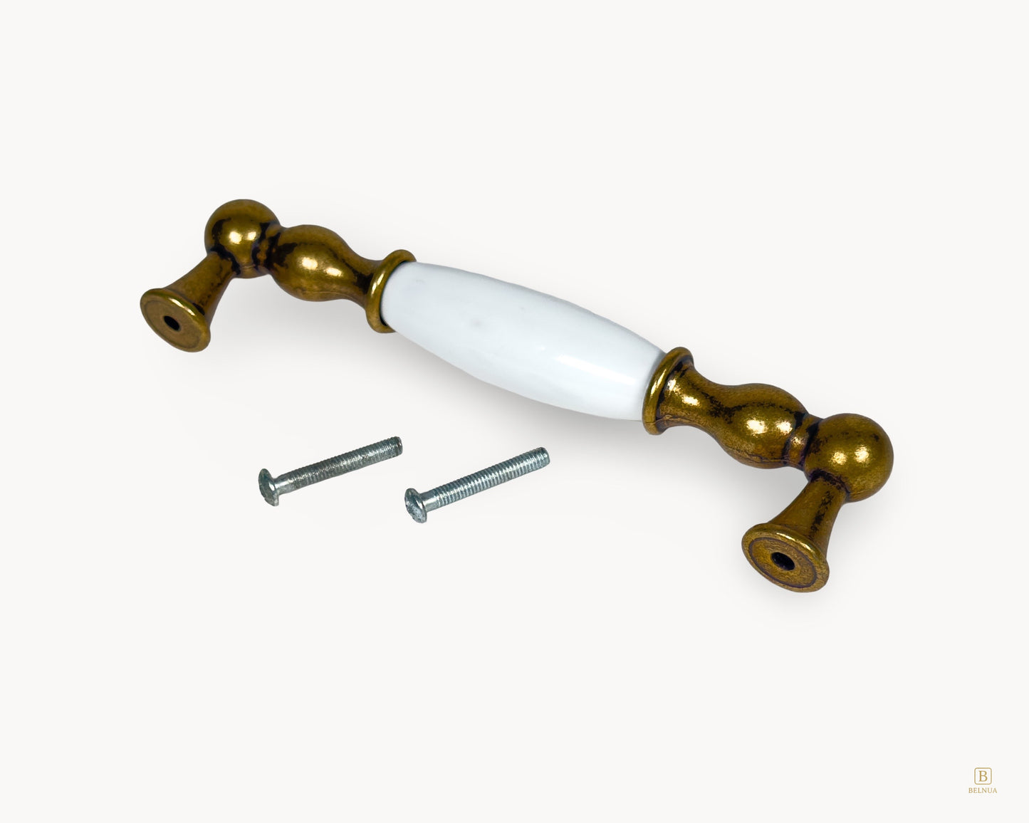Belmira antique brass porcelain handle showing underside and fixing screws, 128mm centre to centre