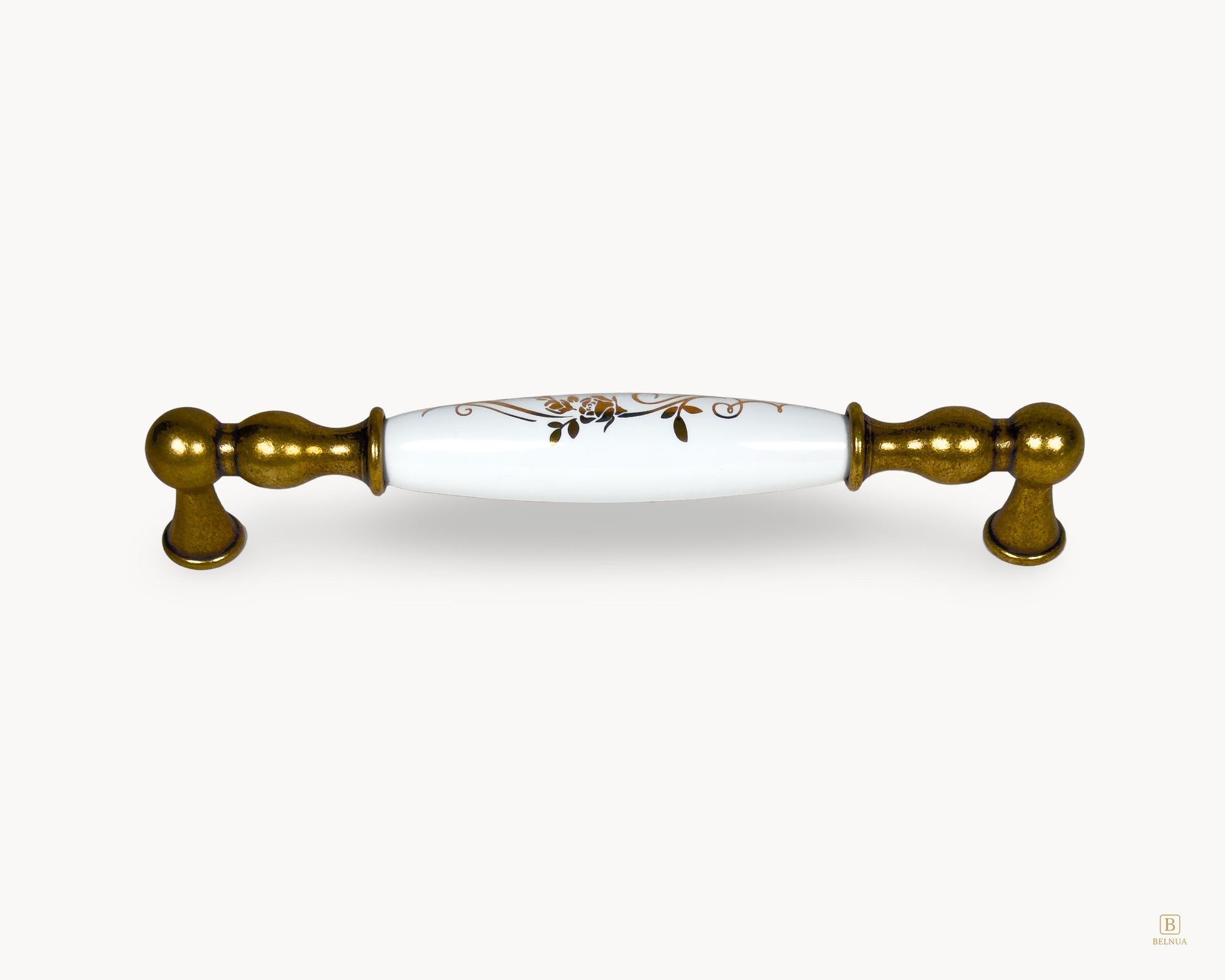 Belnua Belmira antique brass handle with white porcelain insert and golden scroll motif, 160mm centre to centre
