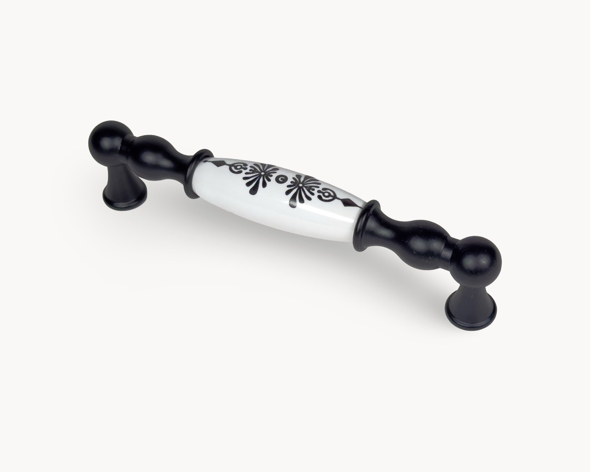 Angled view of Belmira black porcelain handle featuring Midnight Blossom pattern, 128mm