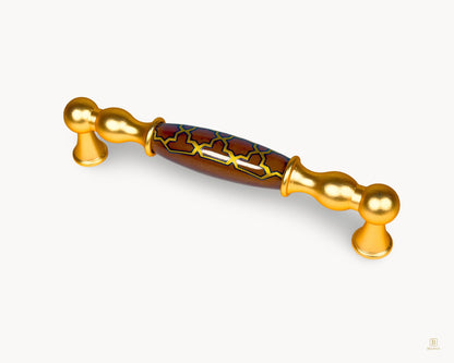 Angled view of Belmira gold 128mm handle with dark brown porcelain and golden tile pattern