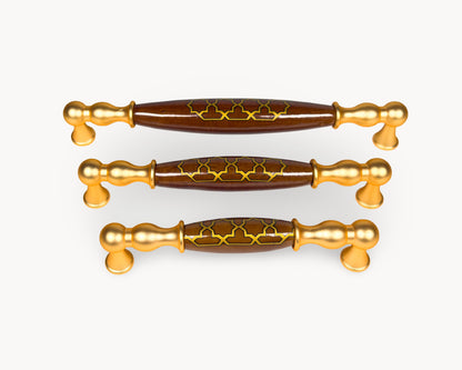 Belmira gold cabinet handles with dark brown porcelain inserts featuring Golden Tile motif, shown in 128mm, 160mm and 192mm sizes