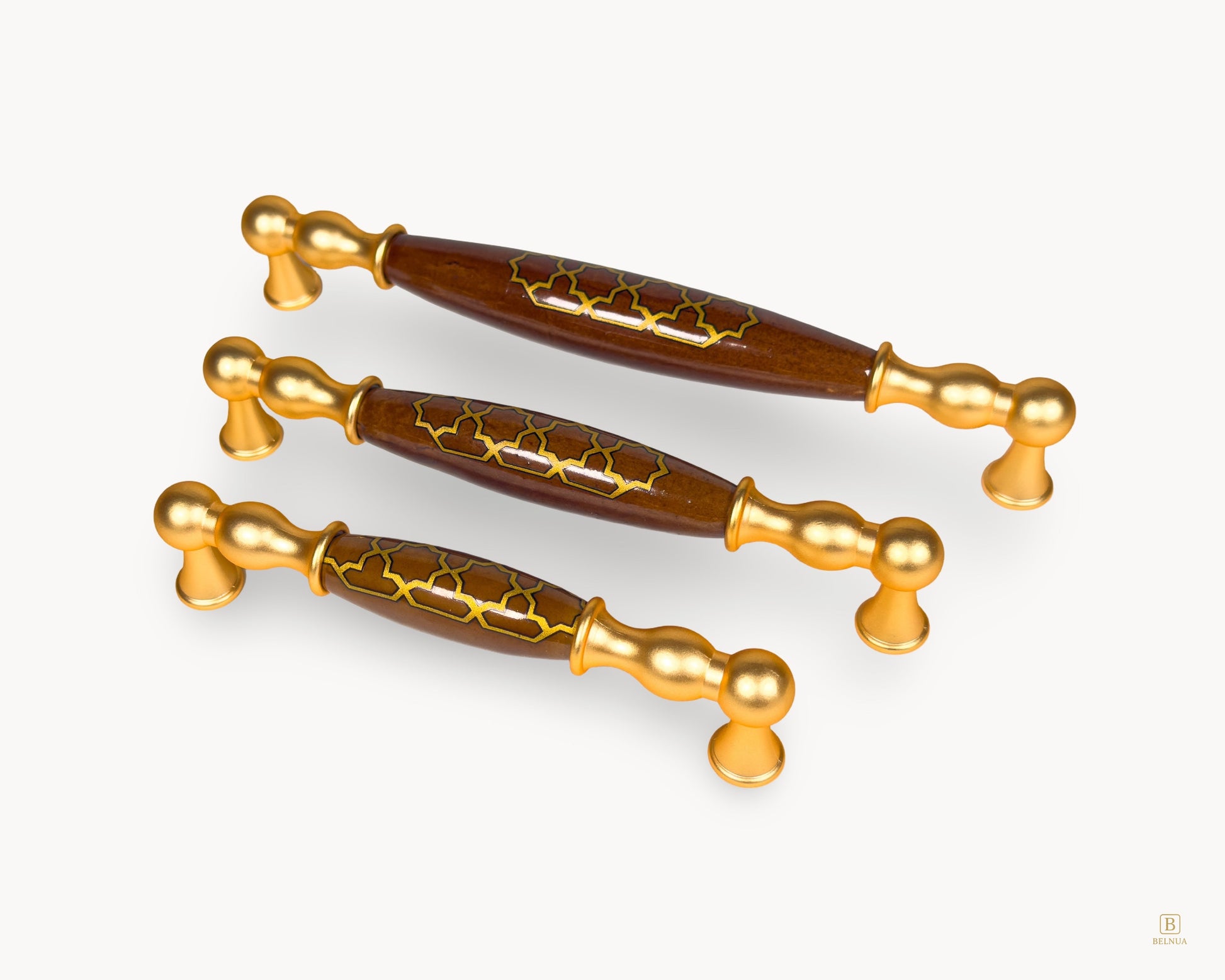 Belmira gold kitchen handles displaying dark brown porcelain Golden Tile motif across three size options