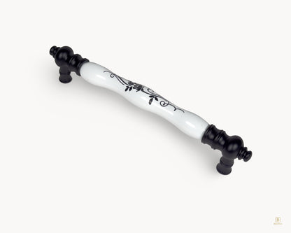 Angled view of Eloura 160mm porcelain handle with matte black metal base and floral pattern