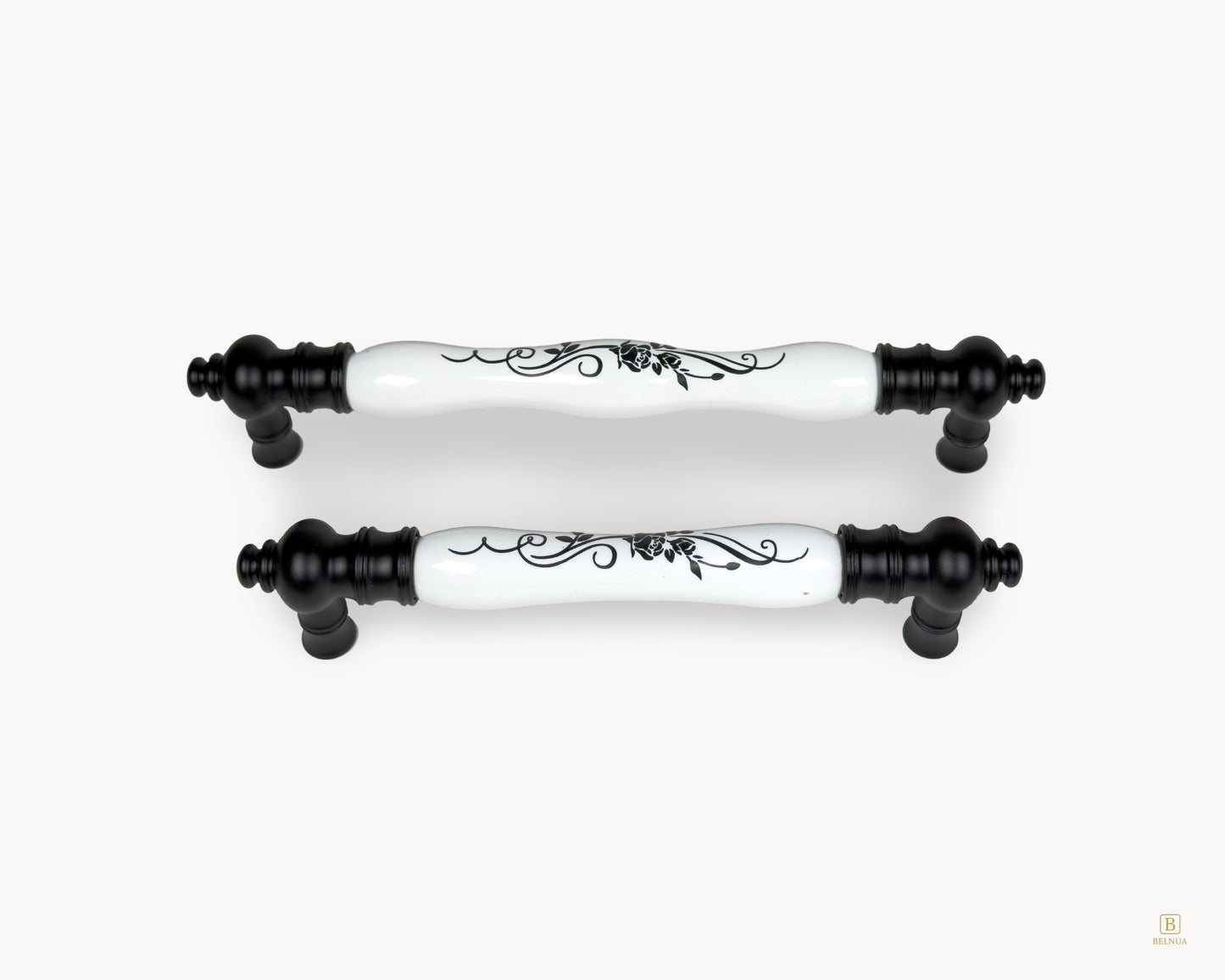 Belnua - Eloura black porcelain cabinet handles with white porcelain insert and black botanical motif, group front view