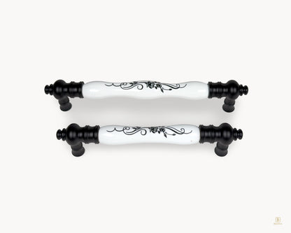 Belnua - Eloura black porcelain cabinet handles with white porcelain insert and black botanical motif, group front view
