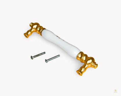 Eloura 128mm gold porcelain handle with Golden Arch Bloom motif shown with fixings, suitable for drawers and cabinet doors