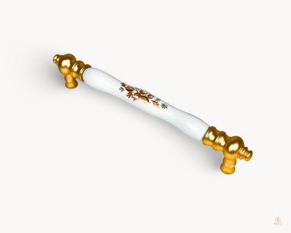 White porcelain handle with gold base and Golden Arch Bloom motif, 160 mm, angled view.