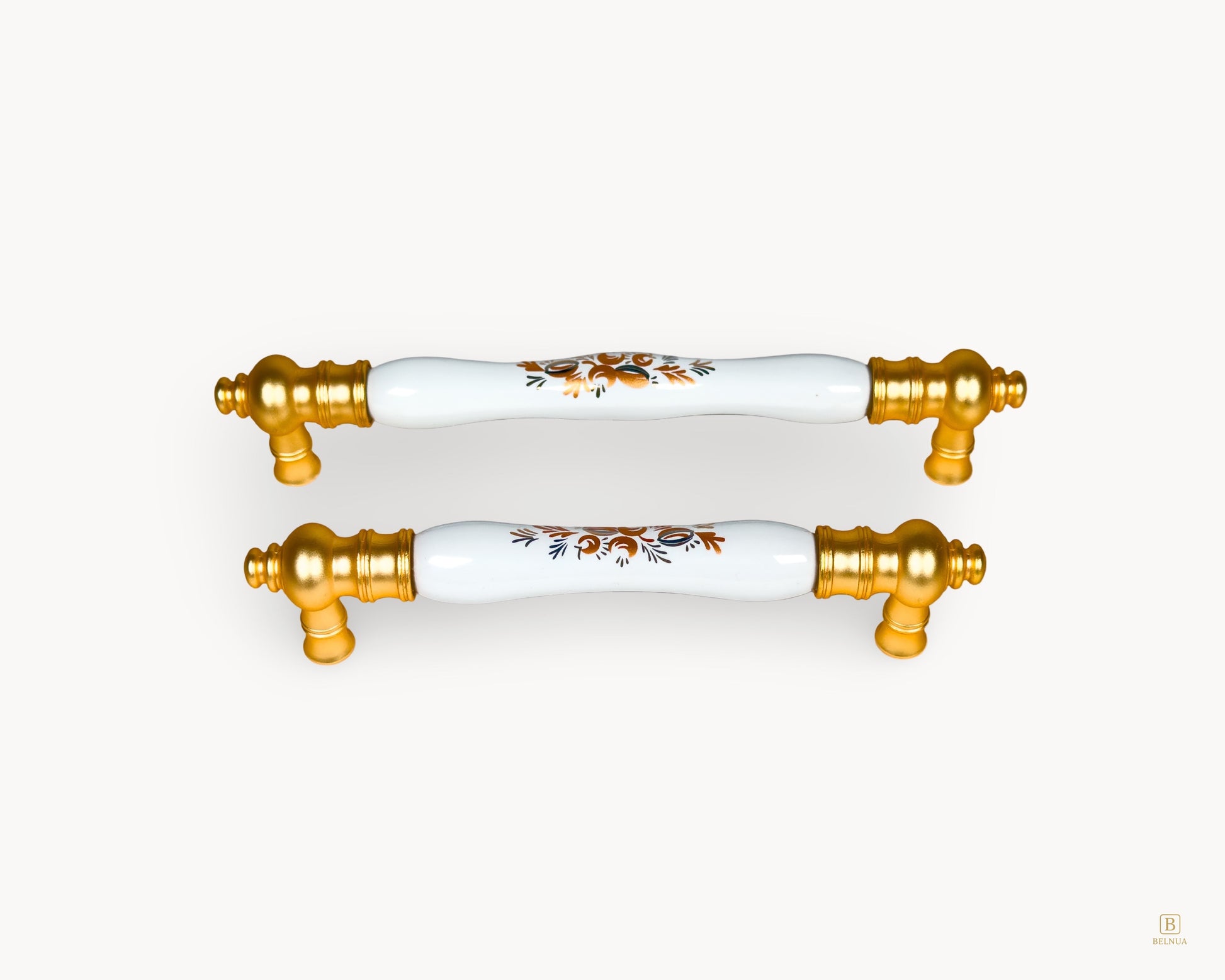Eloura gold porcelain drawer handles featuring Golden Arch Bloom motif, front view showing classic luxury design