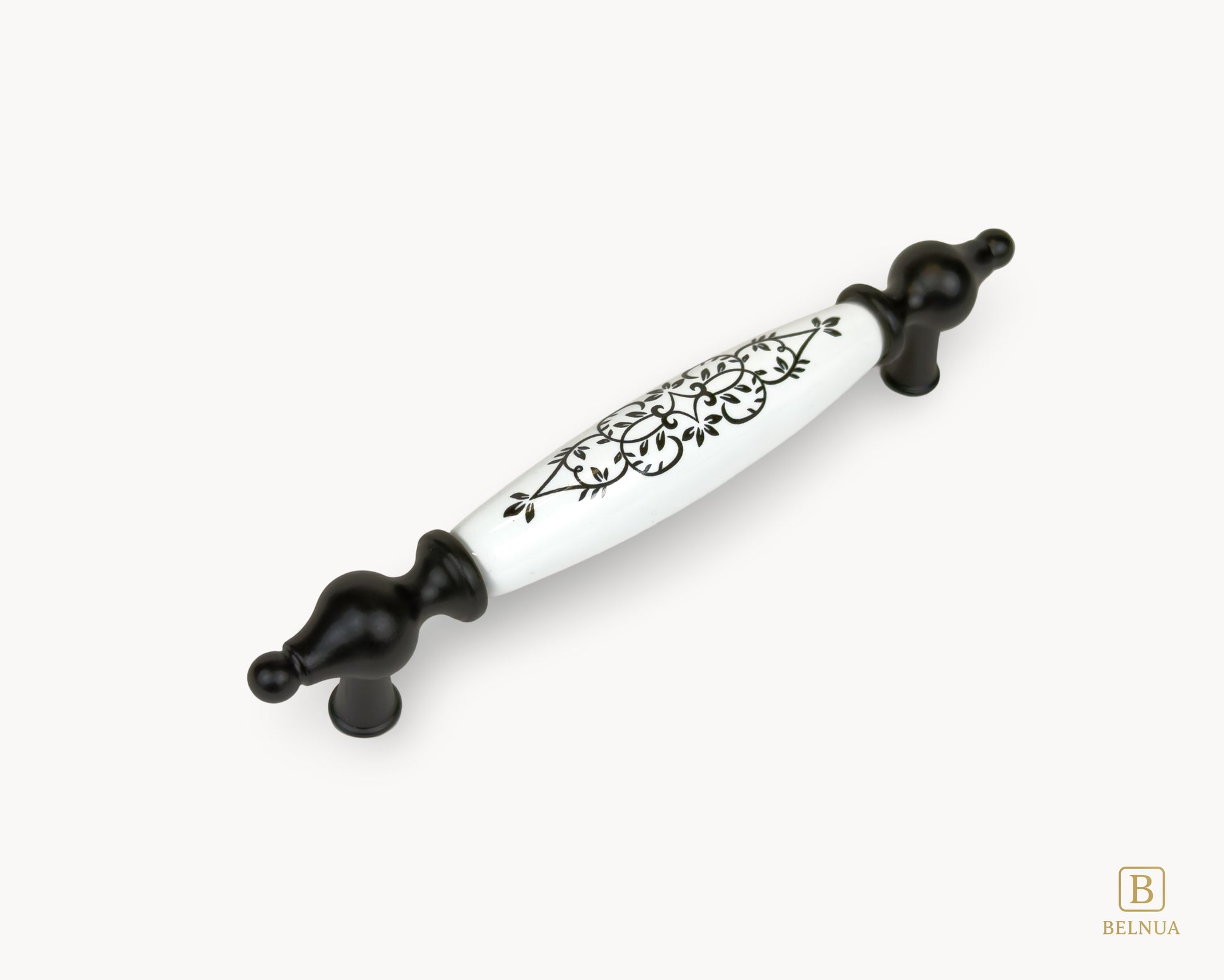 Angled view of Lumora porcelain cabinet handle 128mm with black metal base