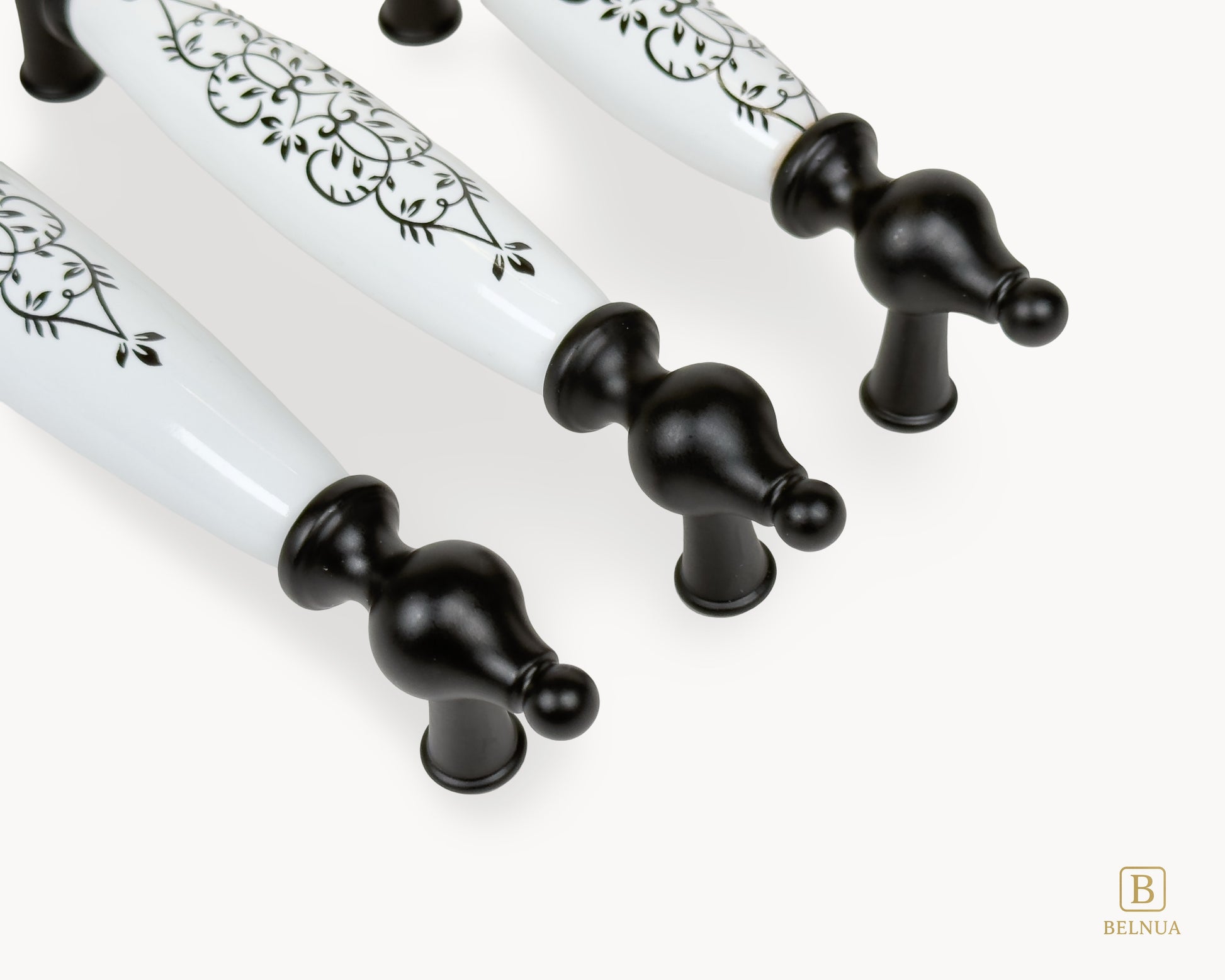 Close-up detail of black base and porcelain floral design on Lumora handles