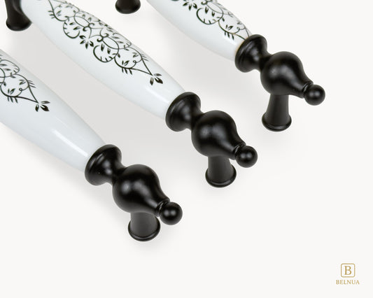 Close-up detail of black base and porcelain floral design on Lumora handles