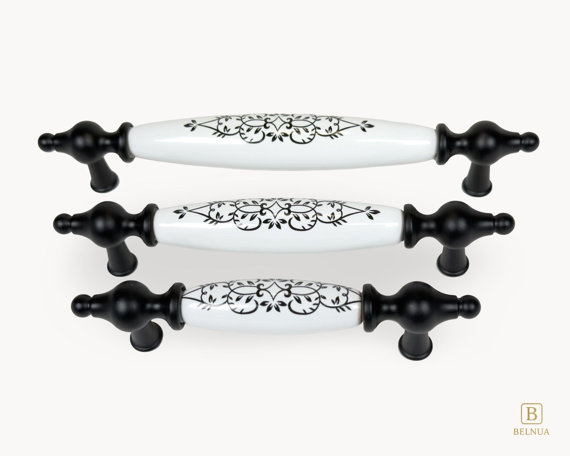 Perspective view of Lumora black porcelain handles showing floral pattern and matte black base