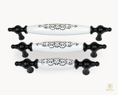 Perspective view of Lumora black porcelain handles showing floral pattern and matte black base