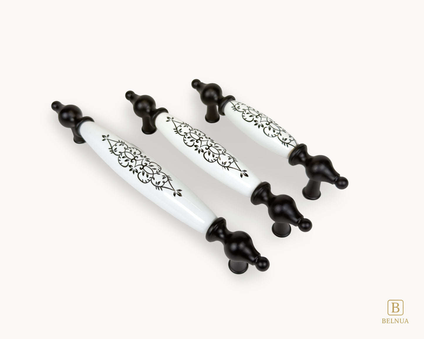 Three Lumora black porcelain handles displayed in angled layout