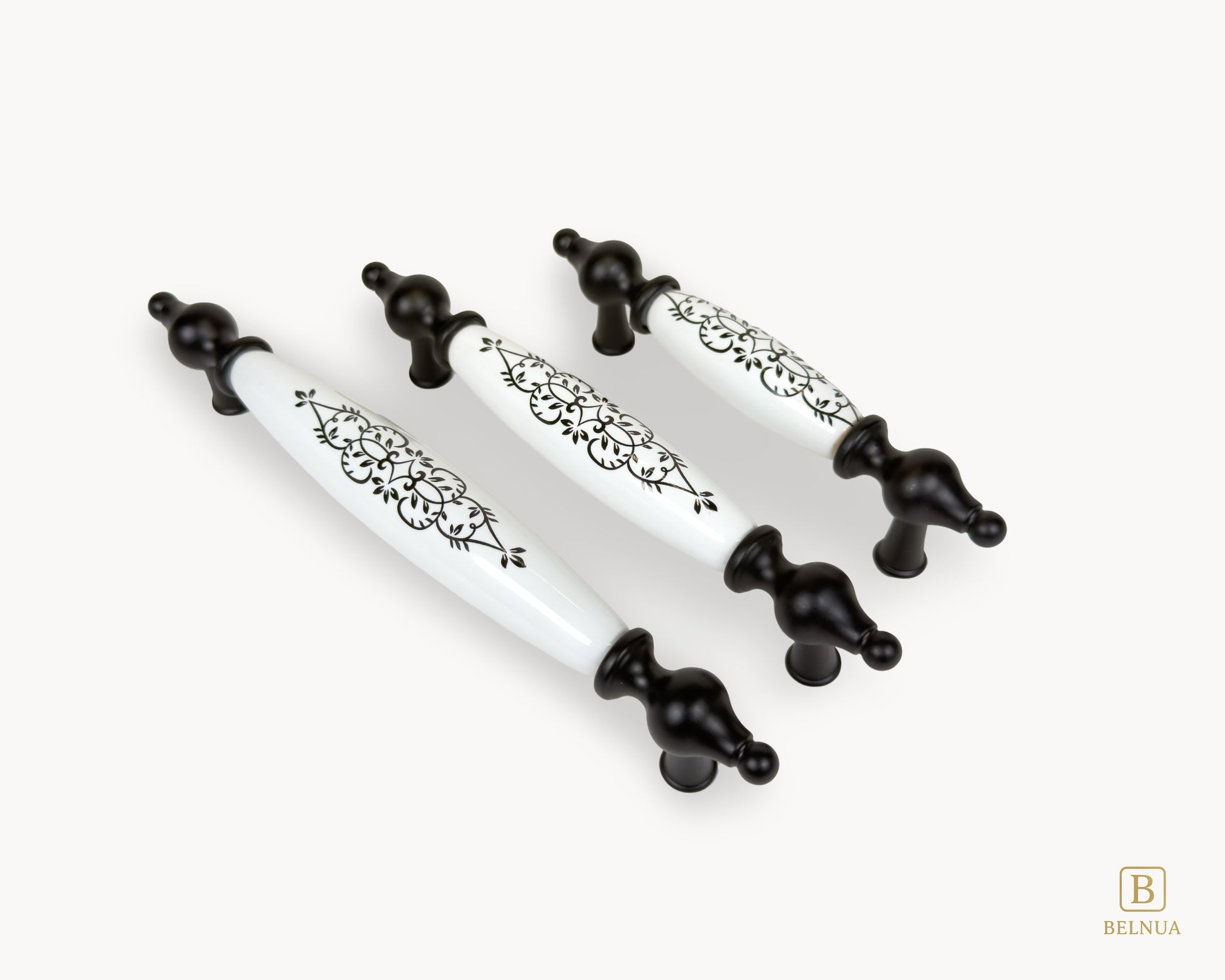 Three Lumora black porcelain handles displayed in angled layout