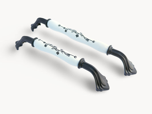 Belnua - Hero image of ROSMIRA decorative matte black handles with black leaf motif on white porcelain 