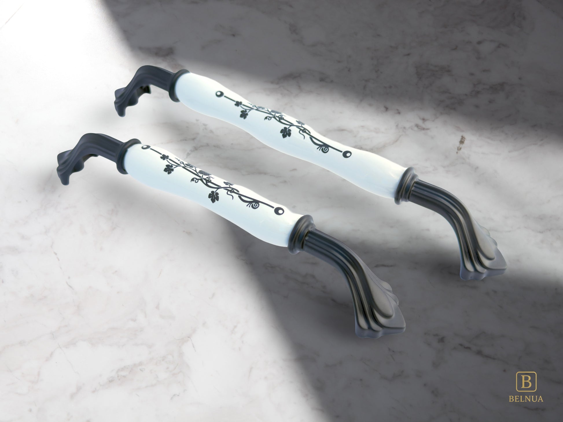 Belnua - Pair of Rosmira decorative matte black handle with black leaf motif on white porcelain featuring with marble work top