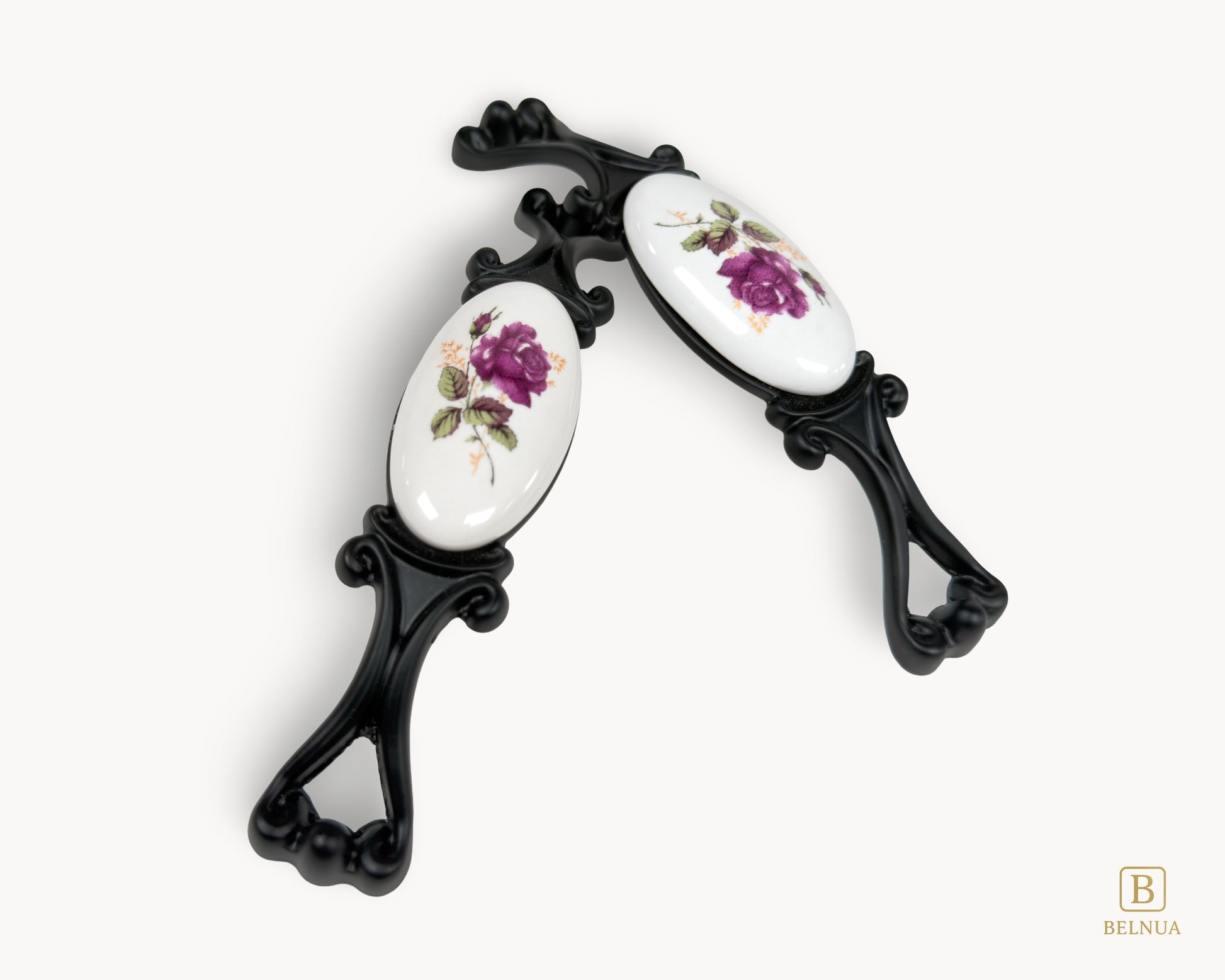 Belnua - Top angled of Nureya cabinet pull handle with black metal base featuring rose motif on white ceramic/porcelain