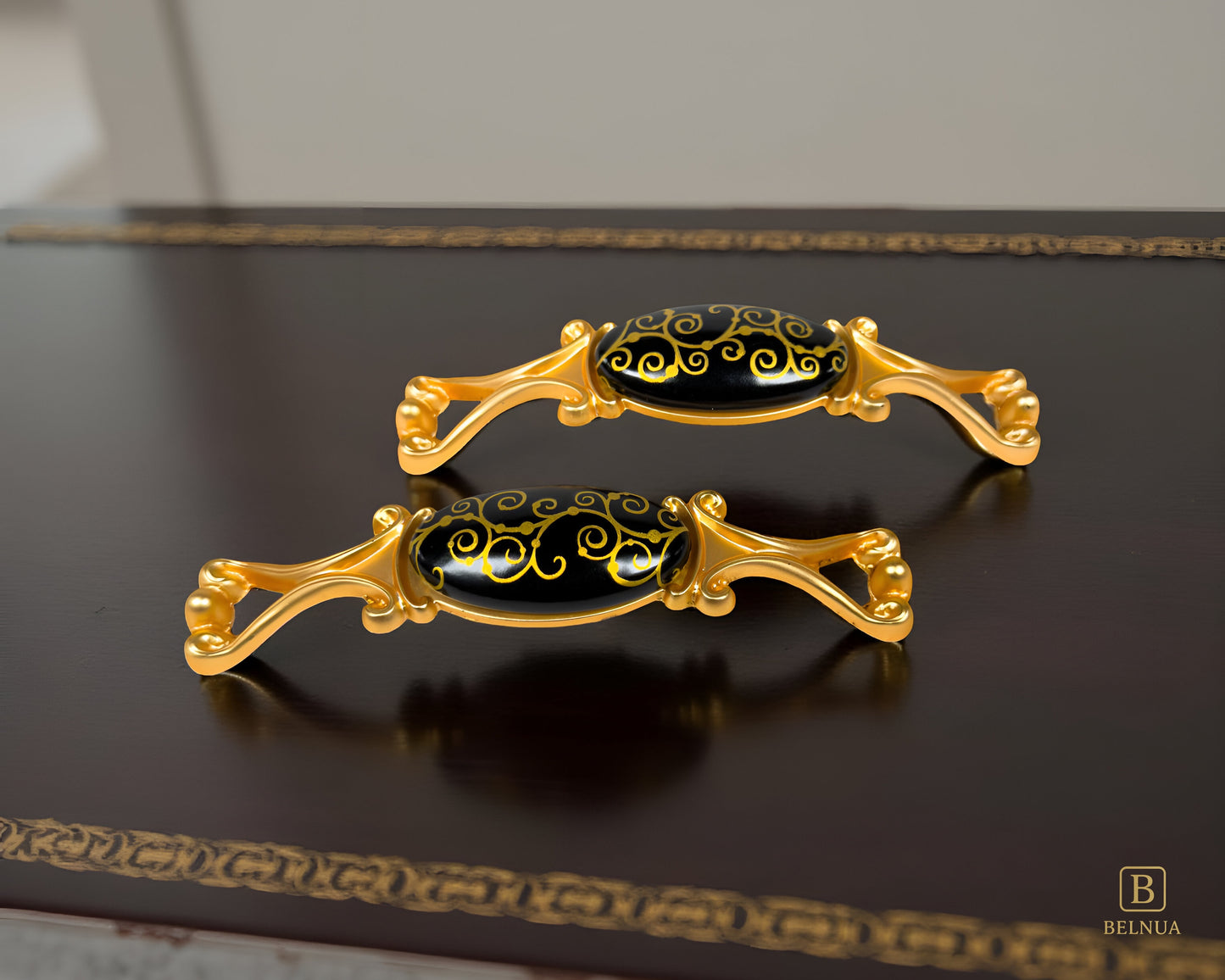 Belnua- Pair of decorative Nureya pulls with gold frames and black porcelain with golden scroll motif with dark walnut table