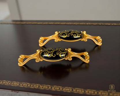 Belnua- Pair of decorative Nureya pulls with gold frames and black porcelain with golden scroll motif with dark walnut table