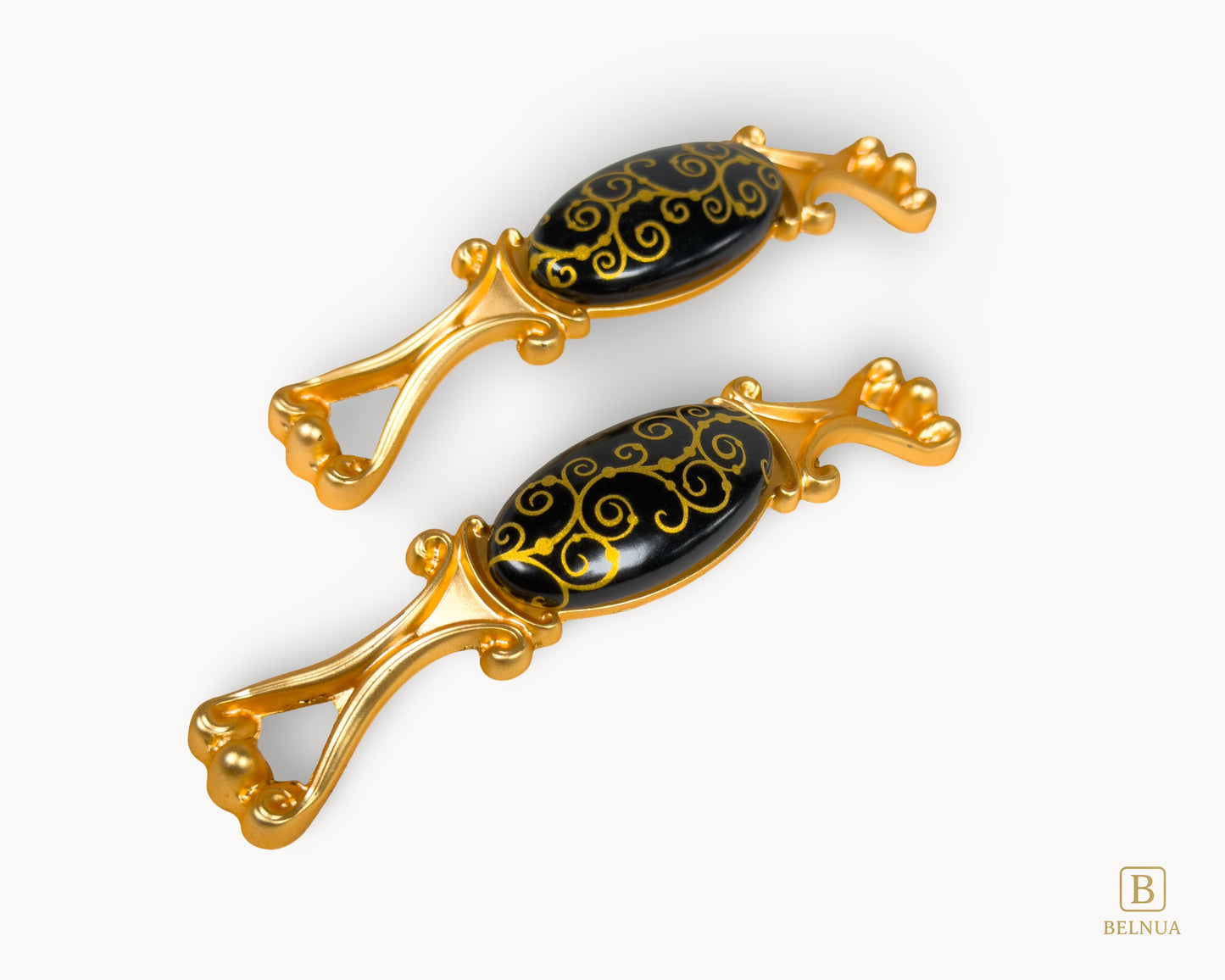 Belnua - Left angled view of Nureya gold pulls with black ceramic scroll motif