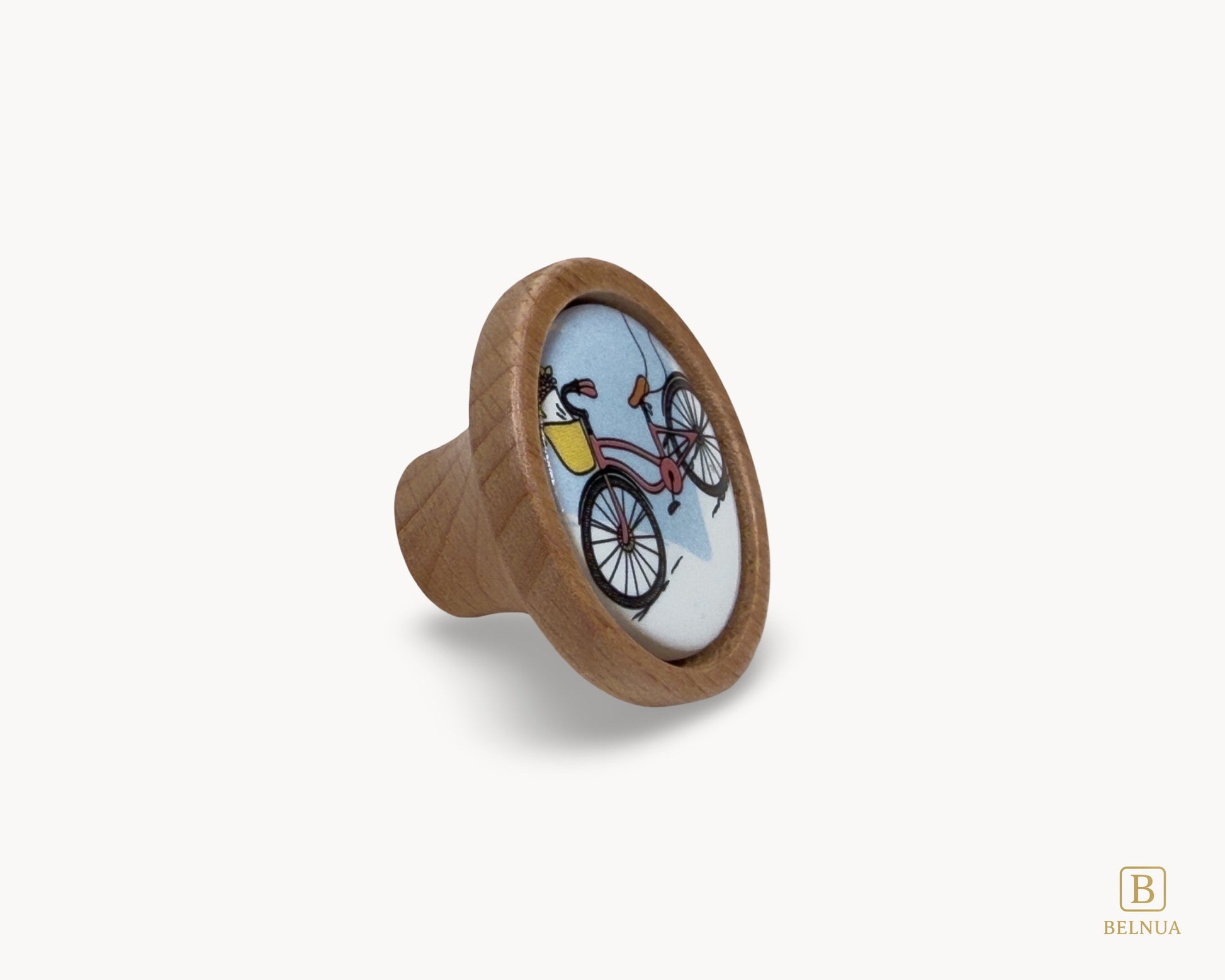 Belnua - Front right angled view of delicate Nuvino children natural oak wood knob with bicycle design porcelain insert for boys, girls, nursery, school, teens room and furniture