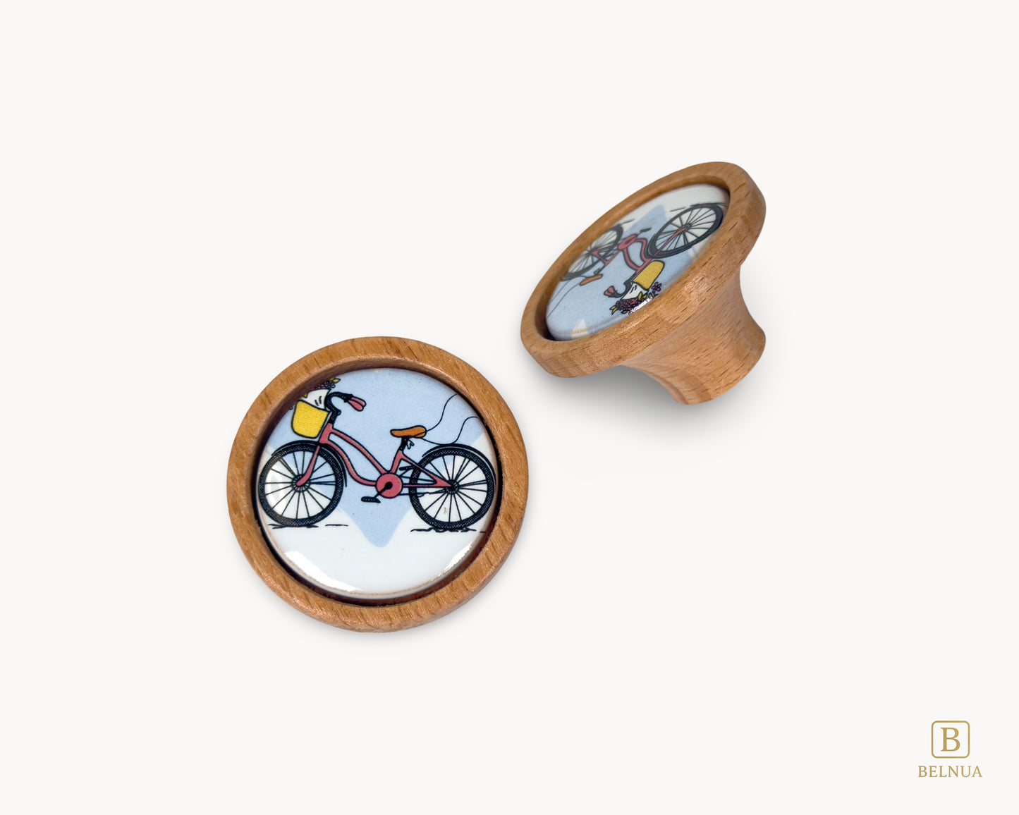 Belnua - Top and angled back view of delicate Nuvino children natural oak wood knob with bicycle design porcelain insert for boys, girls, nursery, school, teens room and furniture