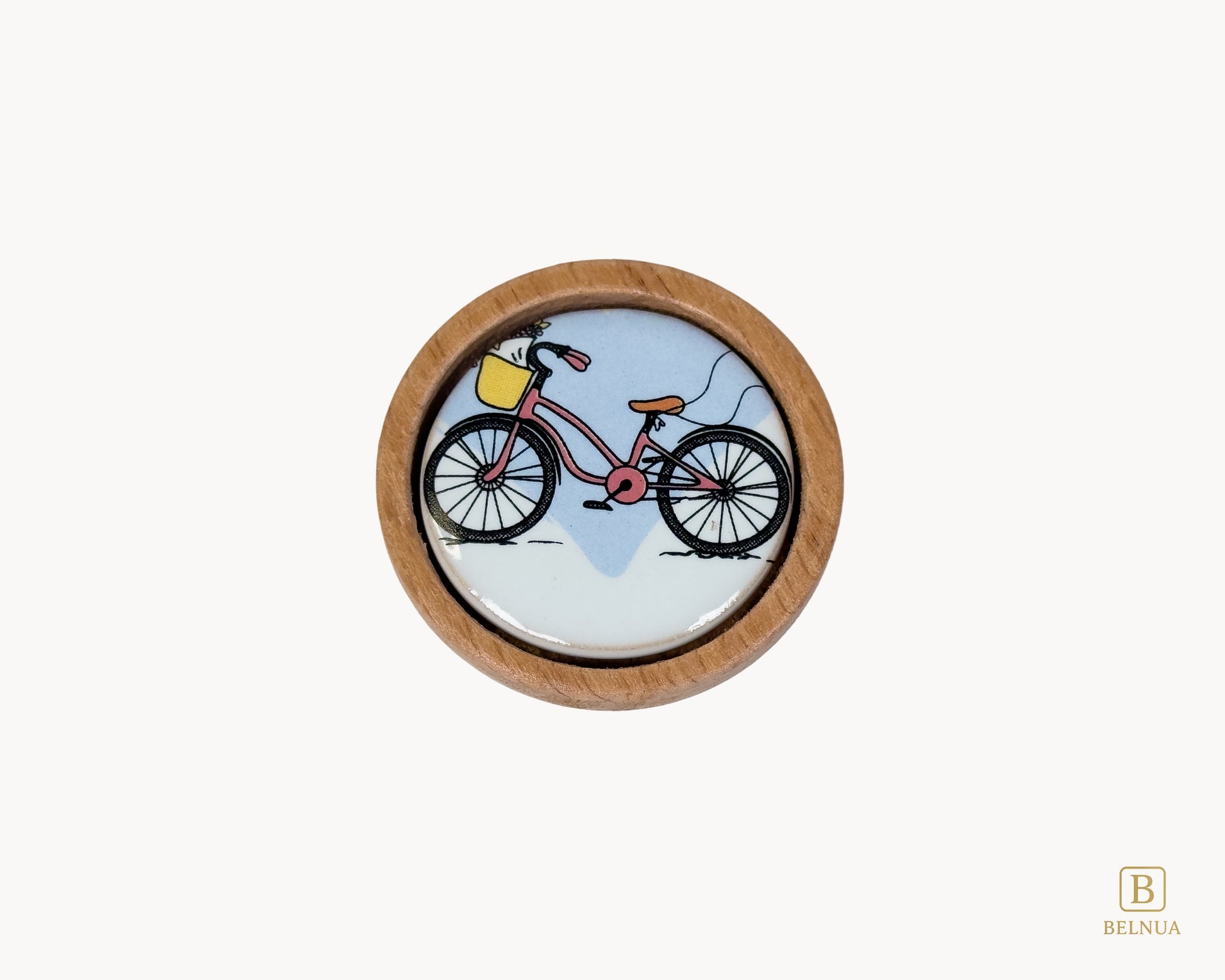 Belnua - Top closeup view of delicate Nuvino children natural oak wood knob with bicycle design porcelain insert for boys, girls, nursery, school, teens room and furniture