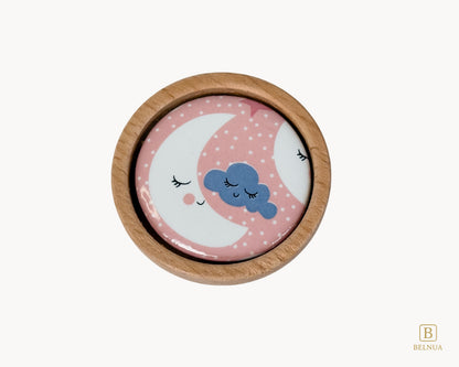 Belnua - Top closeup view of delicate Nuvino children knob with oak wood base and moon&star motif porcelain for nursery, children, teens, girls room and furniture