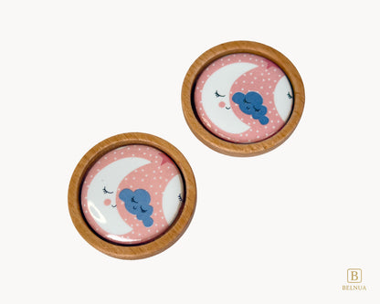 Belnua - Top closeup view of delicate and luxury Nuvino children knob pair with oak wood base and moon&star design porcelain for nursery, children, teens, girls room and furniture