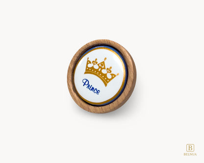 Belnua - Left front view of Nuvino prince crown porcelain knob with oak wood base for boys, children, kids, nursery, teens room
