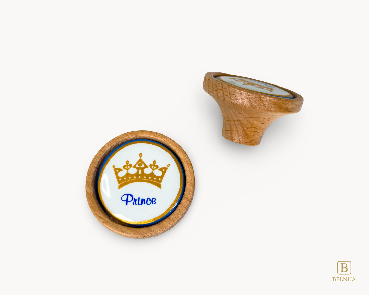 Belnua - Closeup top and left back view of Nuvino prince crown porcelain knob pair with oak wood base for boys, children, teens room
