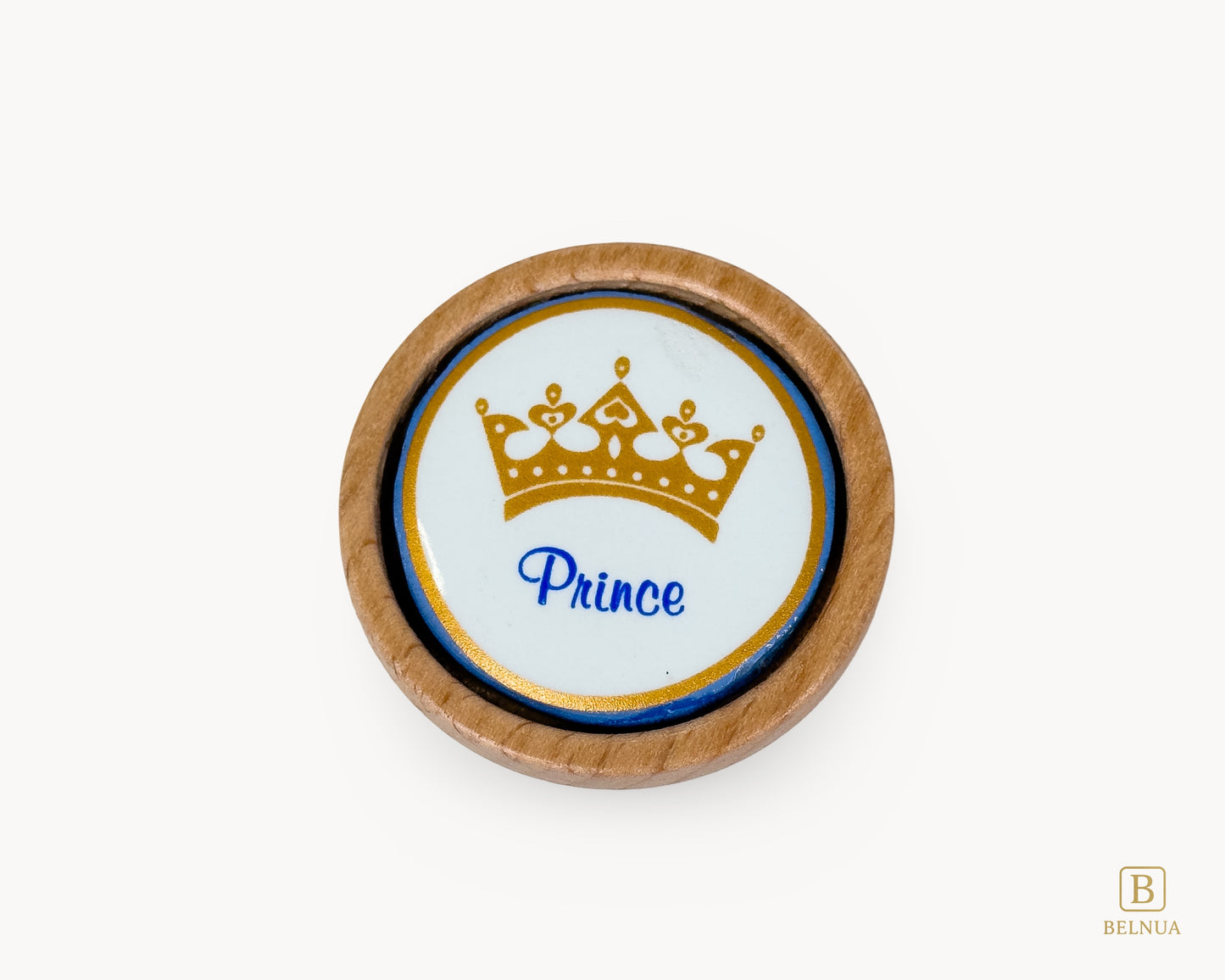 Belnua - Closeup top view of delicate Nuvino prince crown porcelain knob with oak wood base for boys, children, teens room