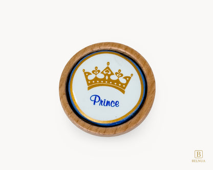 Belnua - Closeup top view of delicate Nuvino prince crown porcelain knob with oak wood base for boys, children, teens room