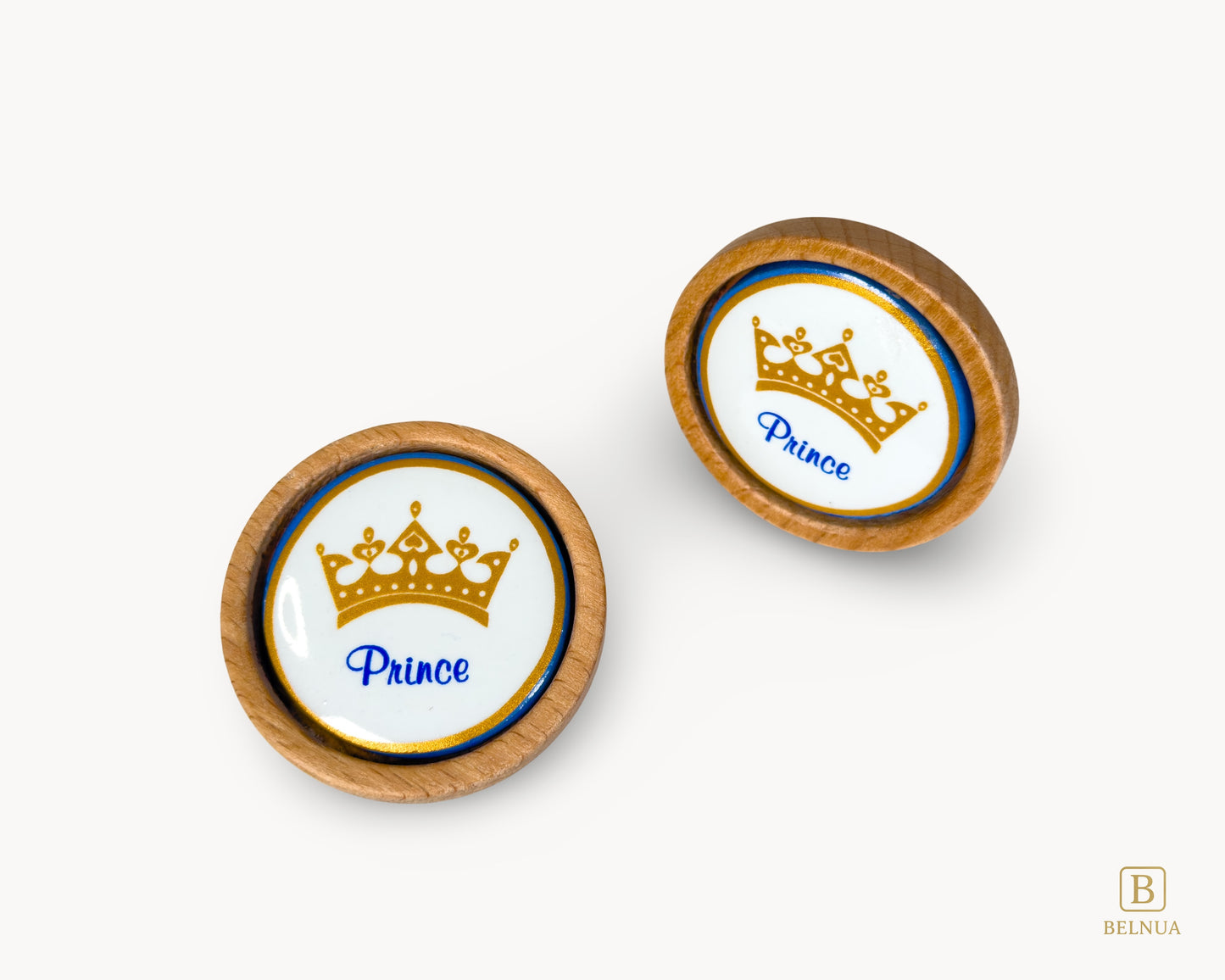 Belnua - Closeup top and angled front view of Nuvino prince crown porcelain knob pair with oak wood base for boys, children, teens room