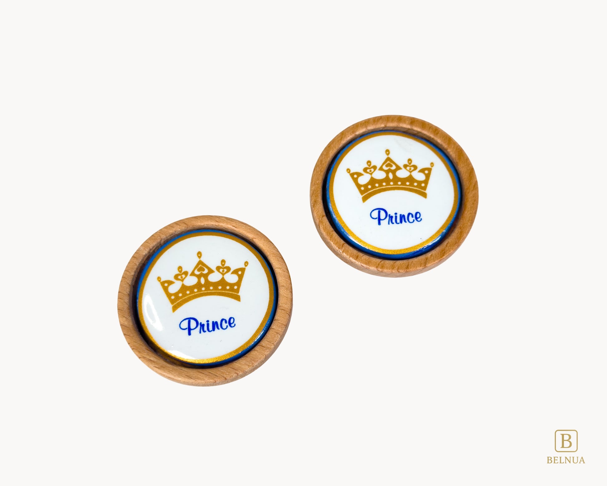 Belnua - Closeup top view of Nuvino prince crown porcelain knob pair with oak wood base for boys, children, teens room