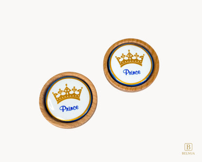 Belnua - Closeup top view of Nuvino prince crown porcelain knob pair with oak wood base for boys, children, teens room