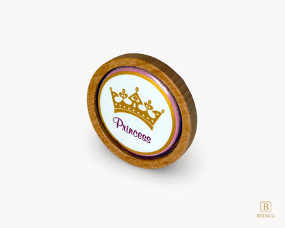 Belnua - Front angled view of Nuvino oak wood knob with porcelain/ceramic insert with princes crown design for girls, children, nursery rooms