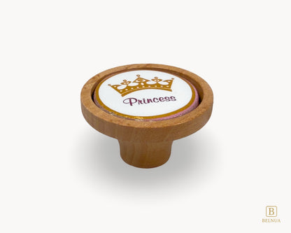 Belnua - Front view of Nuvino oak wood knob with porcelain/ceramic insert with princes crown design for girls, children, nursery rooms