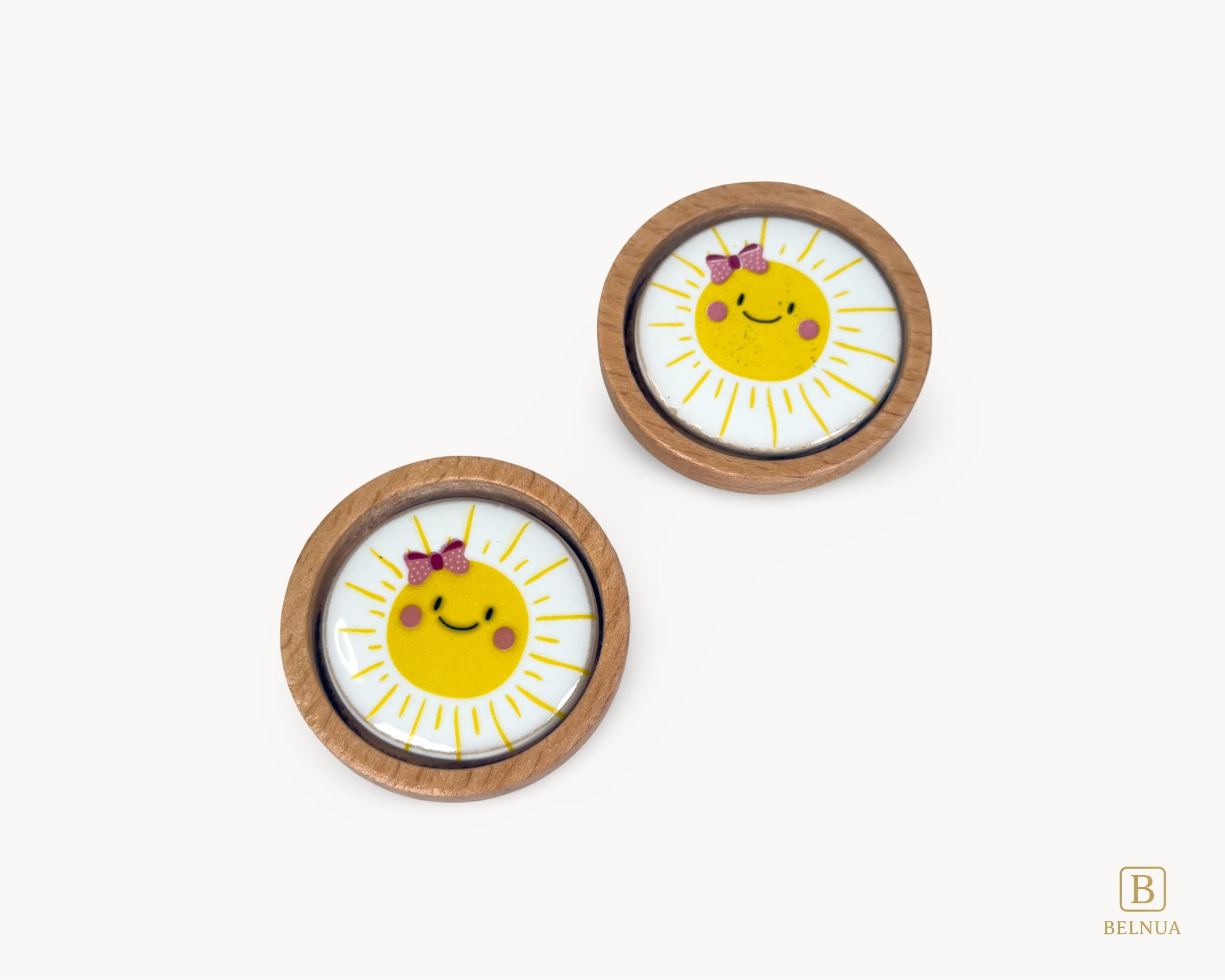 Belnua - Top closeup view of luxury Nuvino children natural oak wood knob with delicate smiling sun porcelain design for girls, children, teens rooms and nursery and school play rooms.