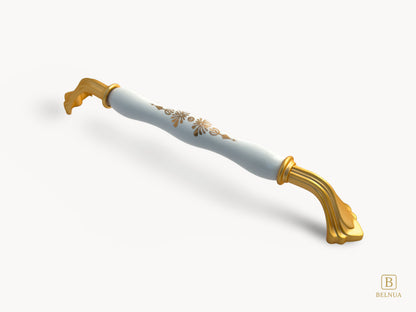 Belnua - Right angled view of rosmira gold handle (192mm) with white porcelain/ceramic featuring golden pattern 