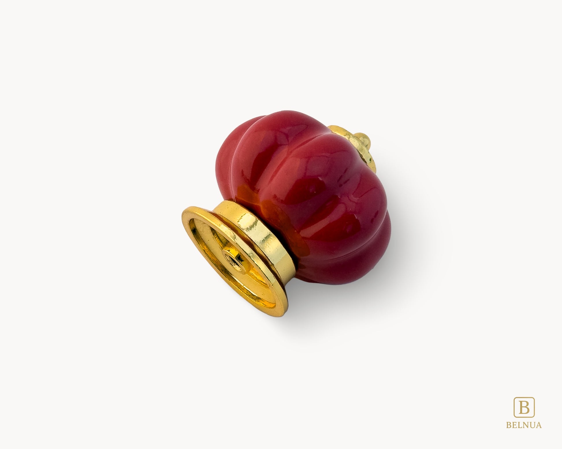Belnua - Left back view of Tavira cabinet porcelain knob in red colour with gold metal base in pumpkin shape