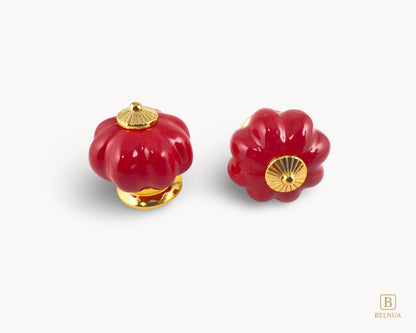 Belnua - Top and front view of delightful Tavira cabinet porcelain knob in red colour with gold metal base in pumpkin shape