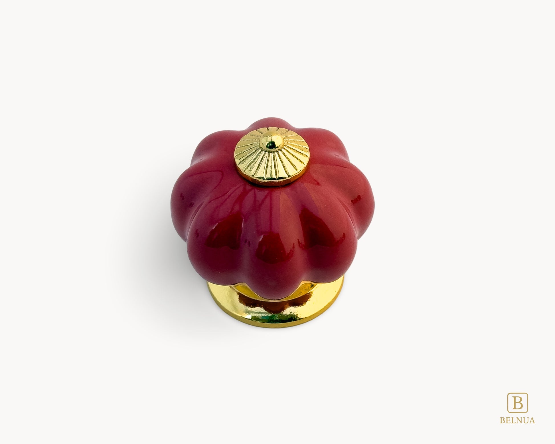 Belnua - Top view of Tavira cabinet porcelain knob in red colour with gold metal base in pumpkin shape