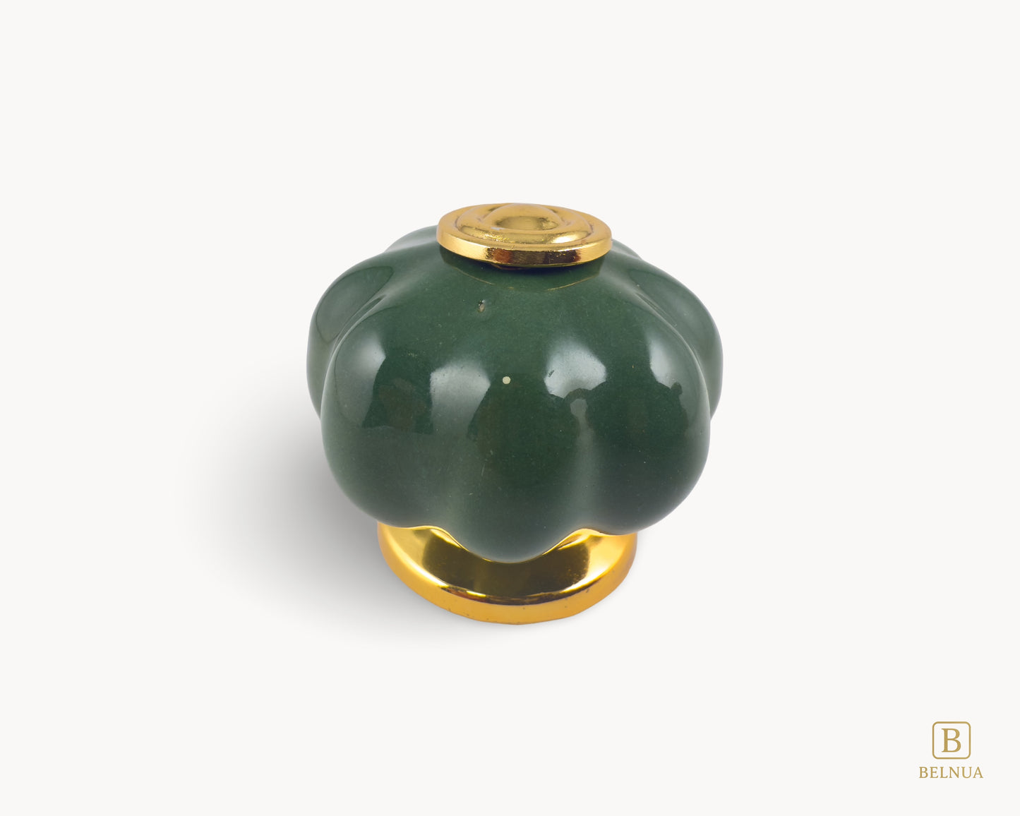 Belnua - Top view of Tavira gold base knob with dark green porcelain insert  with pumpkin design