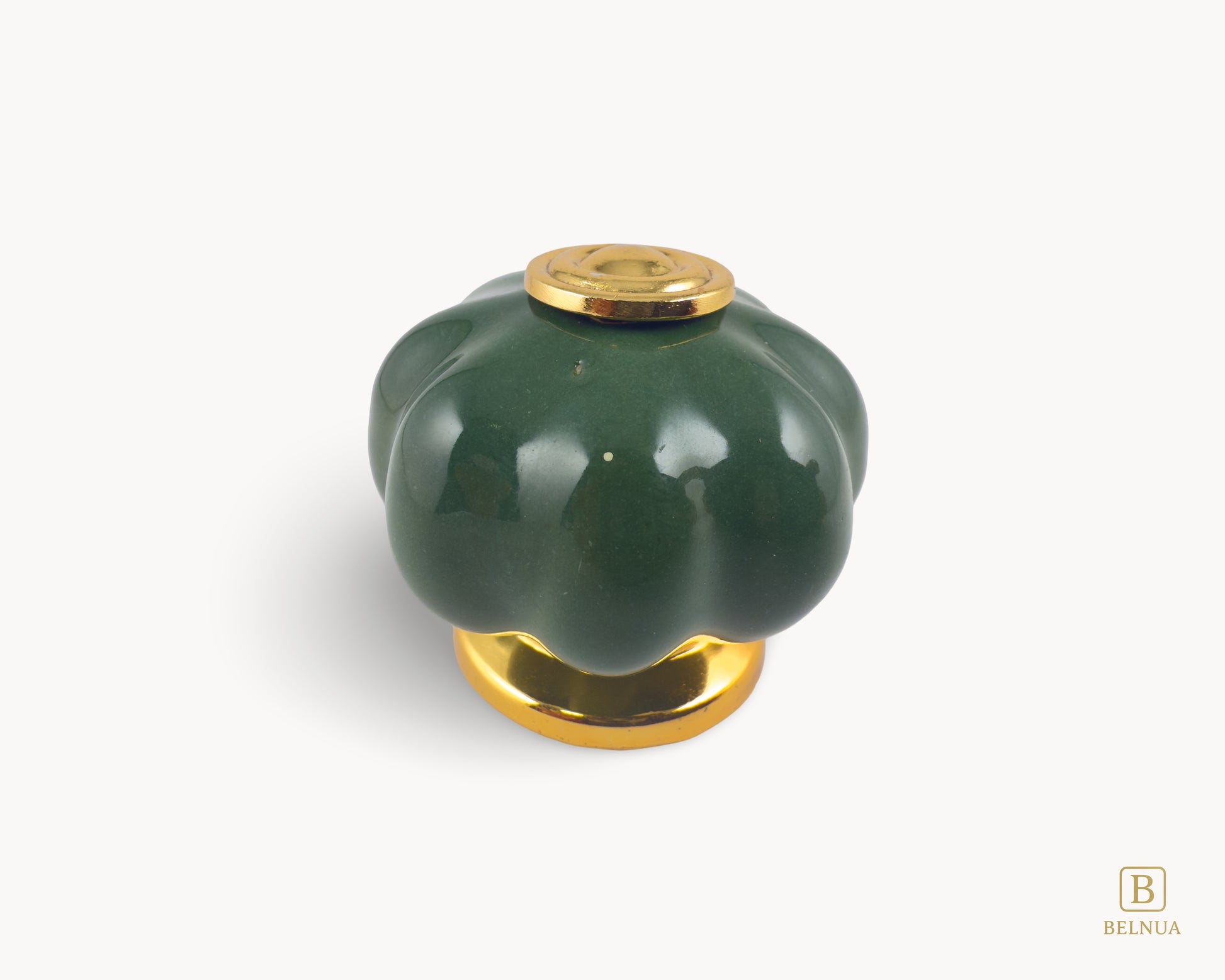 Belnua - Top view of Tavira gold base knob with dark green porcelain insert  with pumpkin design