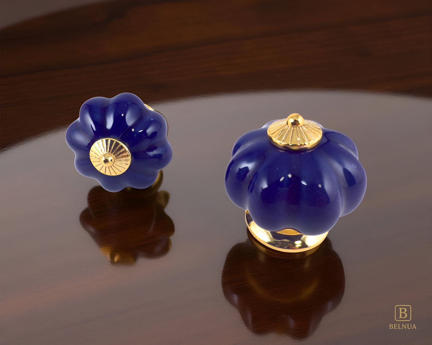 Belnua - Top and left front view of Tavira porcelain cabinet knob with cobalt colour in pumpkin design with gold metal base walnut kitchen worktop